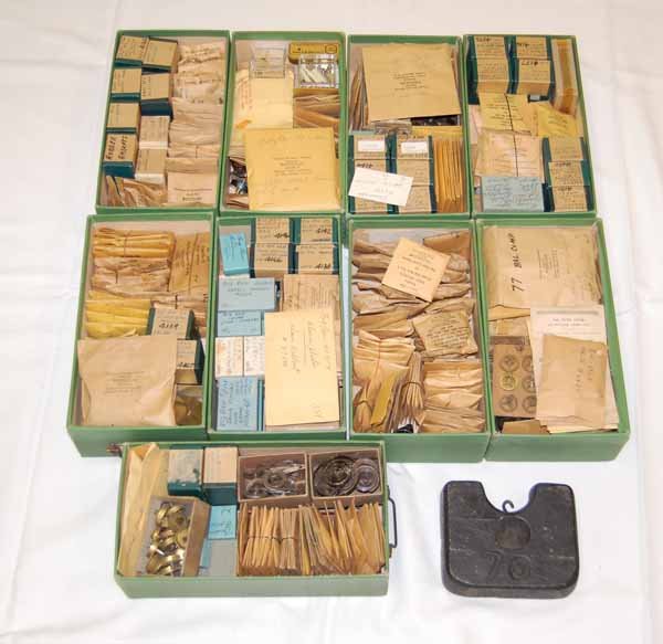 Clock & Watchmaker Parts & Supplies: mostly new old stock. Also including a Howard No. 70 Clock Weight. Provenance: from an estate in Middlebury, VT along with a collection of clock, watchmakers and jewelers tools; numerous pocket watche