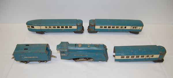 Lionel Train Set: engine marked Commodore Vanderbilt No. 265-E. Lionel "O" Gauge motor. Overall fair condition. Cars are marked 17, 18, 19. Comes with a type W transformer and a whistle controller No. 66 and track.Prov