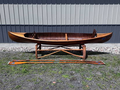 Lakefield Canoe Company Open Tandem Paddling Canoe: Open tandem paddling canoe Also- floorboards, seats and seatbacks and two paddles are in the boat. Cedar strip. Natural finish. Keel. 2 thwarts forward made of birdseye maple. Rear thwart of oak. Gunw