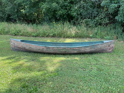 J.H. Rushton Pleasure Rowboat: Model #107 Double-ended lapstrake Pleasure Rowboat. Painted green inside and out. One wooden bottom seat in stern. Fragment of floorboard. Metal plate on bow decking reads "Built/By/J.H. Rushton/Canto