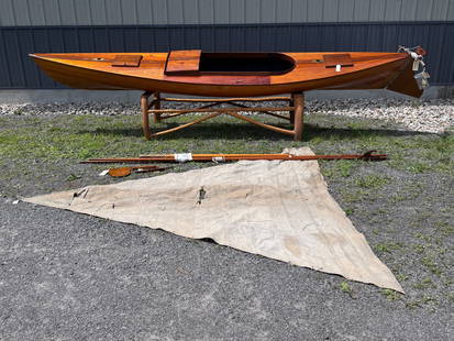 14' Wooden Sailing Canoe "Tootsie": Decked cruising canoe, "Tootsie". Some brass hardware marked Rushton. Varnished wood lapstrake hull. Varnished deck with coamings.. Interior painted flat black. L: 14' B: 30" Wt: 80 lbs Built by an un