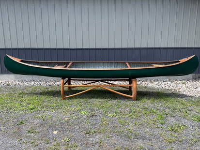 Indian Girl Rushton 16' Wood Canvas Canoe: Indian Girl model canoe designed by J.H. Rushton and built by his former workman, Everett "Cyclone" Brown. Wood-canvas construction with many layers of paint. Has an outside keel, the classic Rushton-