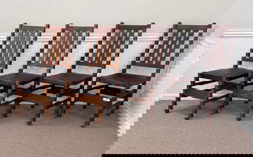 Gustav Stickley Set of 4 Dining Chairs: original leather seats, partial piece of original paper label on one. All 4 chairs are solid and in good condition with some wear. 17.5" x 16.5" x 39.25"