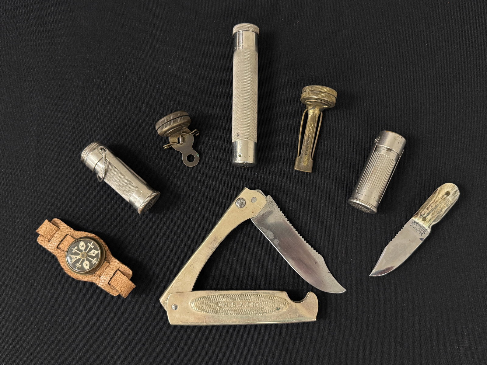 Marbles Gladstone Michigan Collectibles: includes: folding knife, gun cleaning kit, match holders, 3 compasses and a 4 inch miniature knife. 8 pieces total.