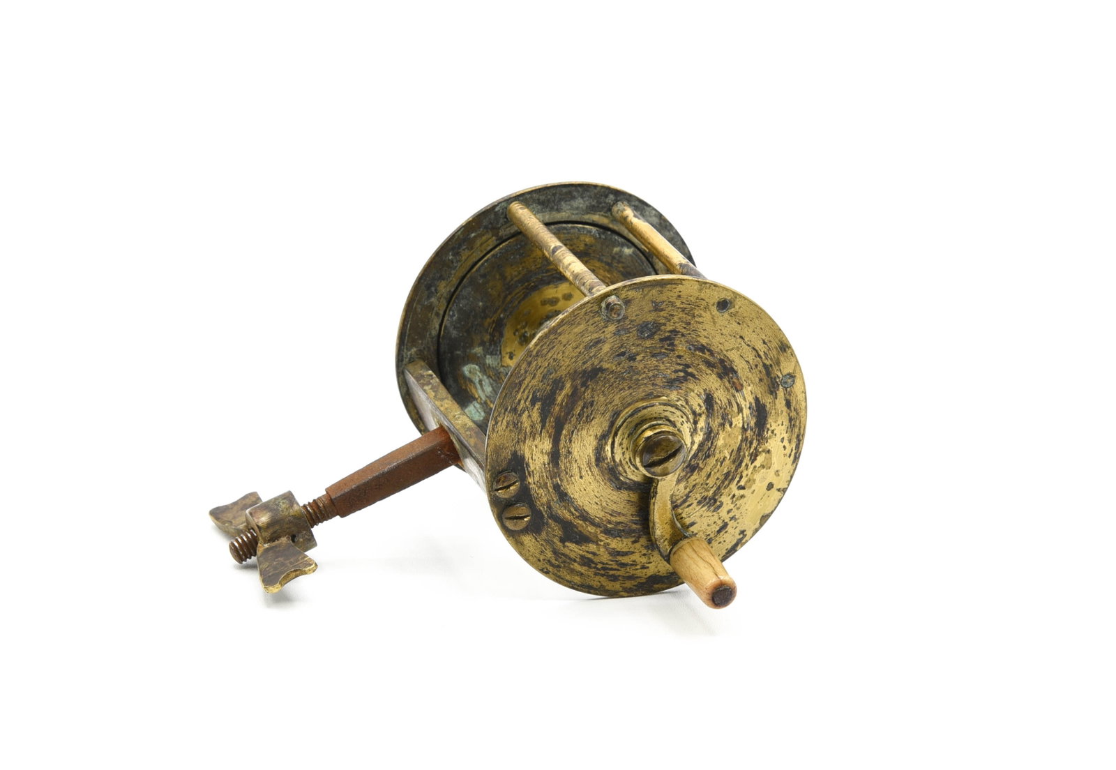 Early Spike Winch: Circa 1840, with a 2 7/16" diameter and 2 1/8" wide spool, iron spike foot with brass butterfly screw, half handle with a bone grasp that turns well. Unmarked and uncleaned with expected wear, corrosi