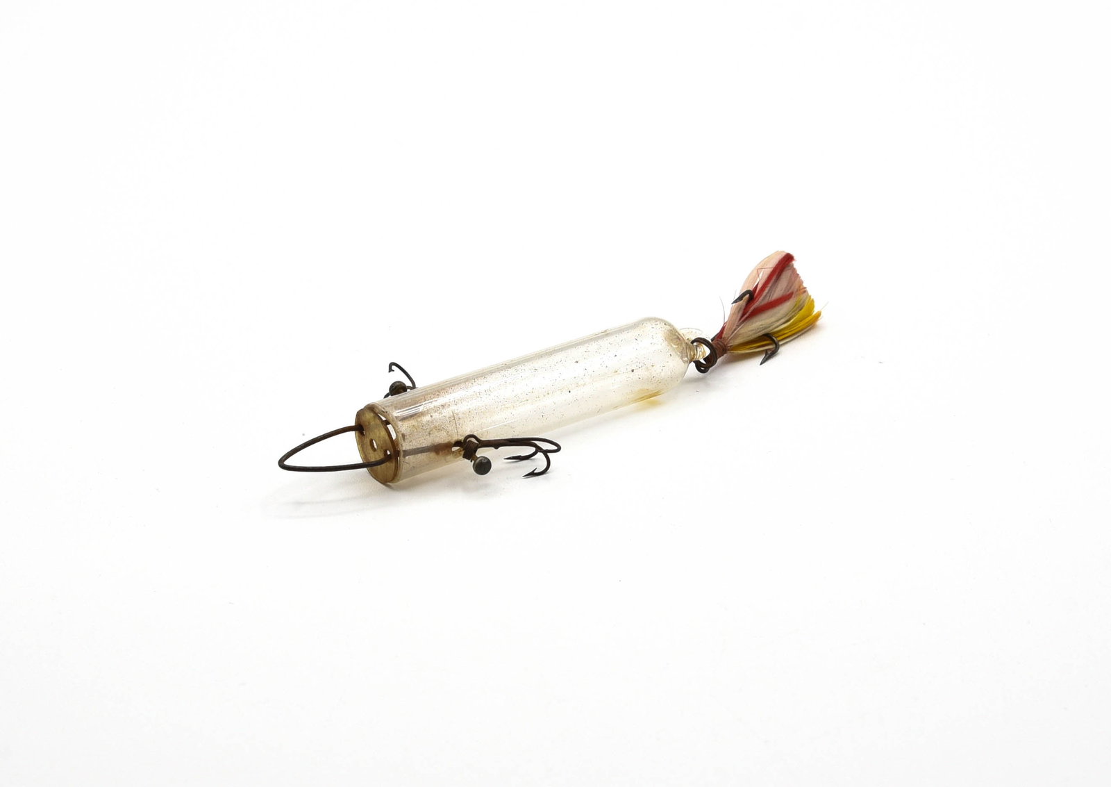 Pfeiffer Glass Minnow Tube: Measuring 3" in length, including the rear glass hook hanger loop, rigged with 3 small treble hooks and the early sliding celluloid cover. In Ex-/Ex condition due to interior soiling that should clean