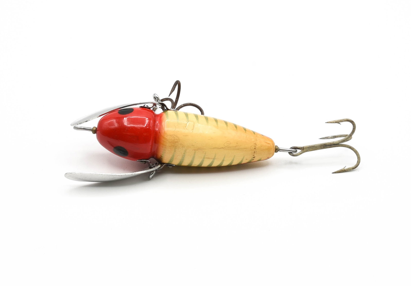 Heddon 2150 Musky Crazy Crawler: Rigged with heavy duty toilet seat hardware, Pat 1677176 stamped wing, and finished in red and white shore with red side scales. With general light wear, pointers/hook marks, surface dings and age lin