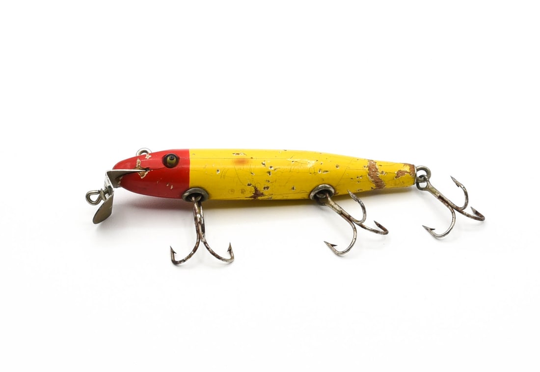 Creek Chub "Test Bait" Pikie: One of only a scant few glass-eye 700 Pikies known in this graphic uncataloged red head yellow body finish. Made decades before the Wiggle Diver was produced in this color, this very rare early pikie 