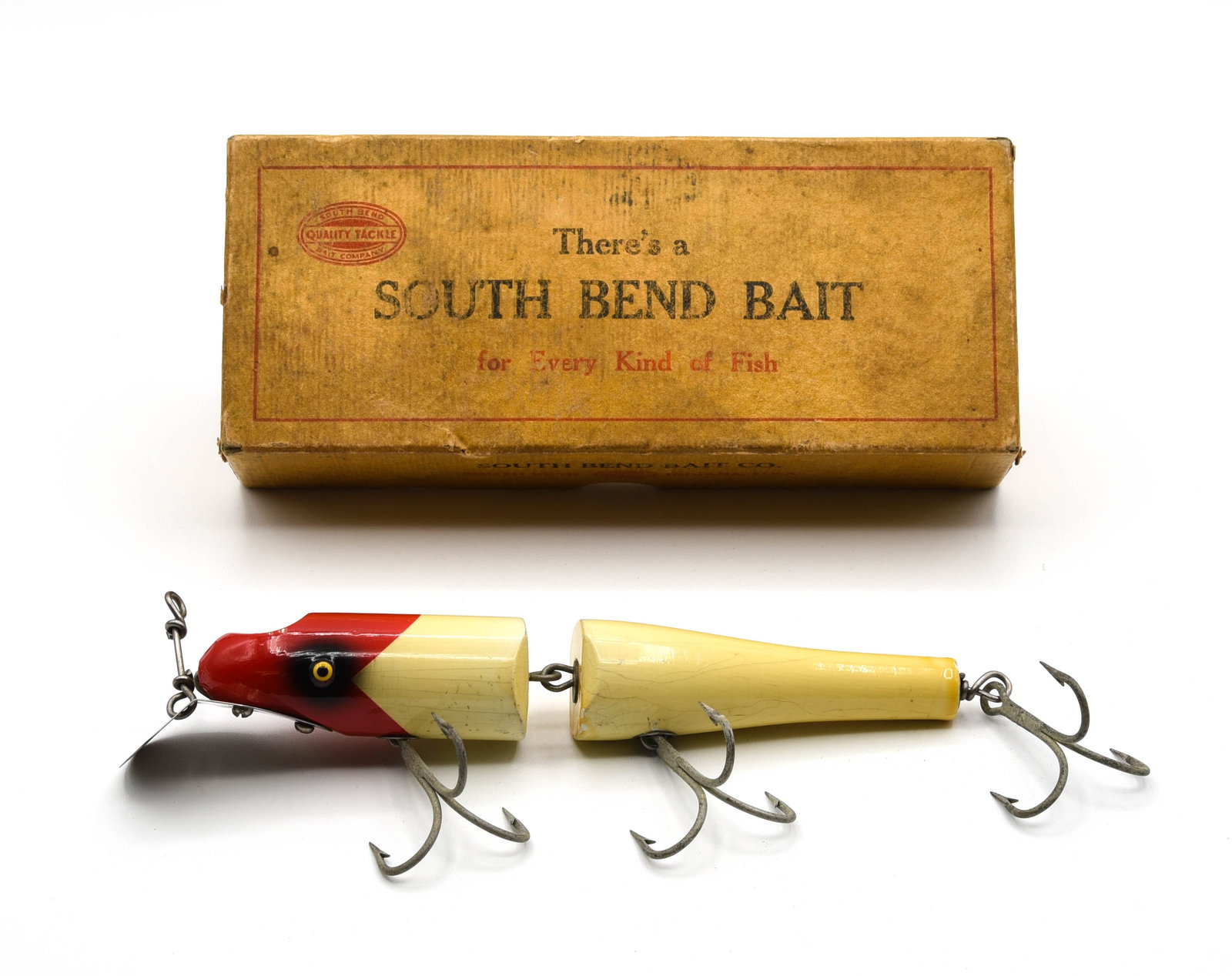 South Bend Giant Jointed Pike-Oreno: In shiny red arrowhead white with tack eyes and marked lip, at least Ex- condition, and coming in its faintly stamped 960 RW intro box that's VG-/VG but solid.