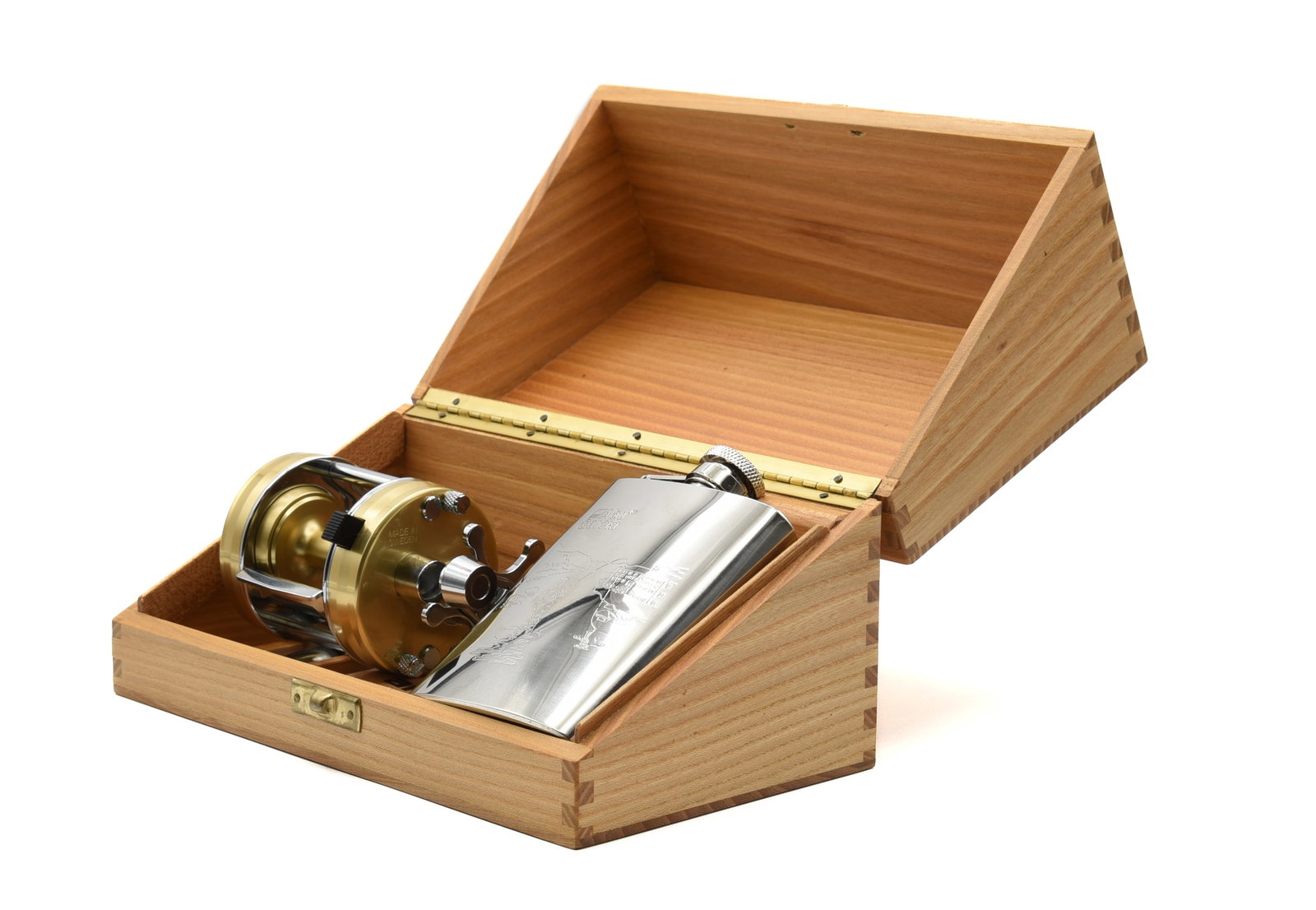 Ambassadeur Limited Edition 2500C Reel: Numbered 070007 and in as new condition, Ex/Ex+, coming in its wooden presentation box that also houses a 3 1/2 ounce stainless steel flask with Abu Garcia logo, an oil tube and wrench.