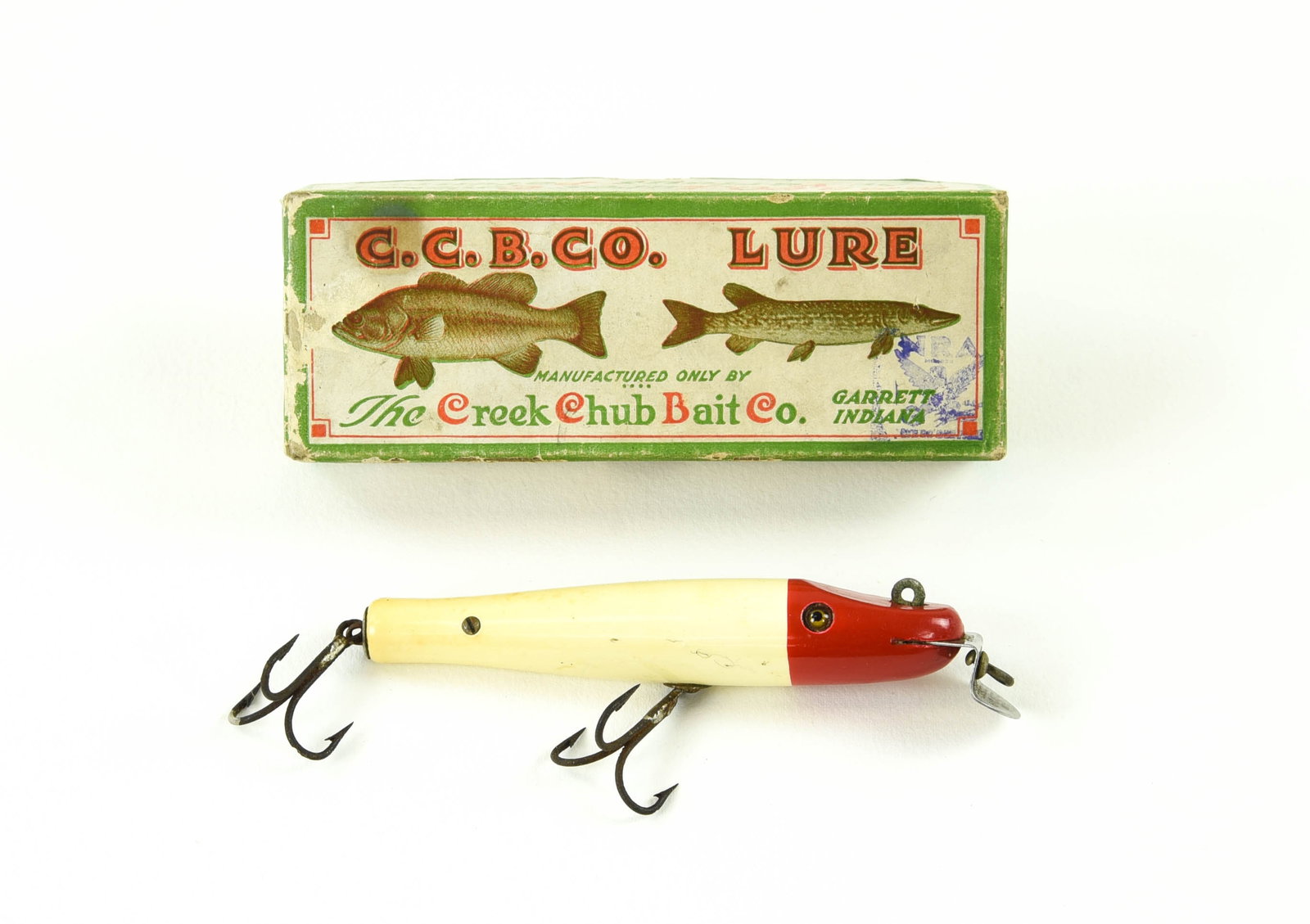 Early Creek Chub 702SW Pikie: The introductory model of the saltwater 700 in shiny red and white finish, with wire through rigging, side screws, good glass eyes, and rarely seen swiveling belly hook. If not for hook rust started, 