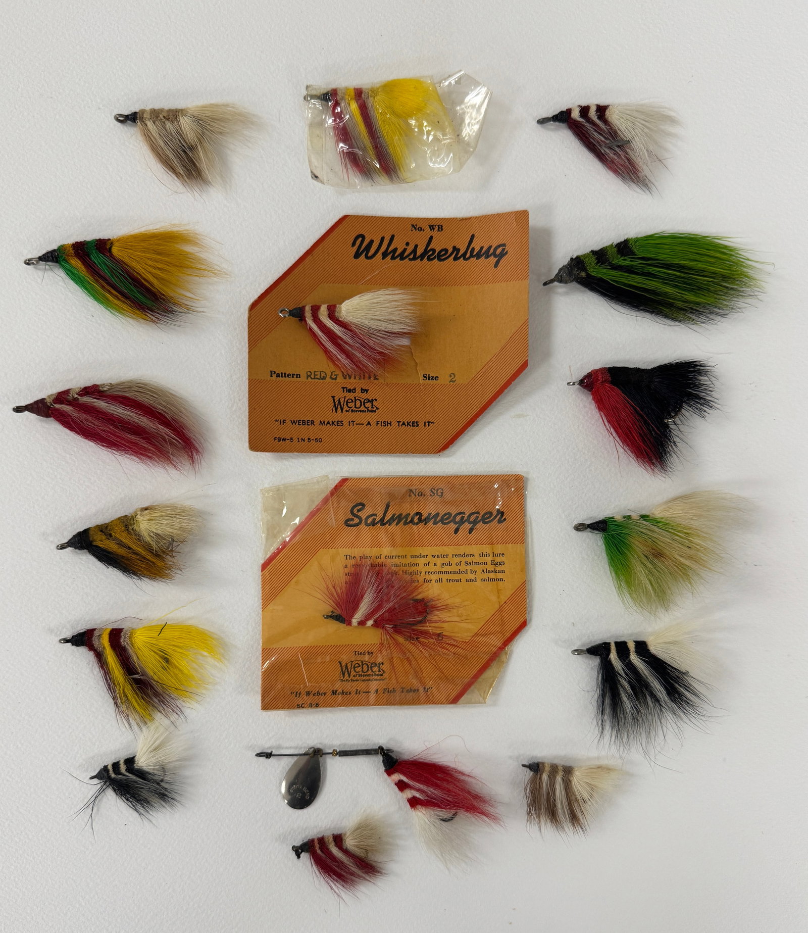 Weber Flyrod Whiskerbugs: Includes a No. WB card with Whiskerakle, one in a cellophane envelope, one with South Bend spinner, 13 loose, and one still stapled to a Weber No. SG Salmonegger card with the original cellophane. In