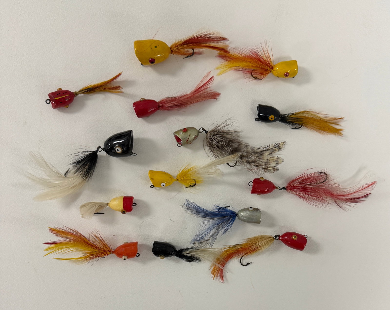 Weber Flyrod Poppers: Sold by the Weber Lifelike Fly Co., 14 baits with affixed eyes and a shiny finish. Includes several models and sizes including the seldom seen largest Poppers as well as several with a trailing