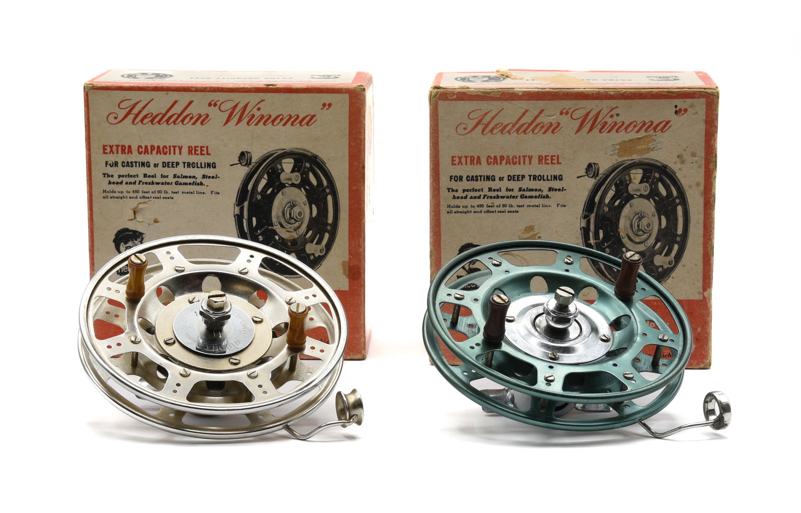 2 Heddon Winona Reels: Includes a model 105FF with a green anodized finish in the correct but unmarked box, and a model 105SS in the correctly stamped box. Each reel is in Ex condition, appearing unfished, with the boxes