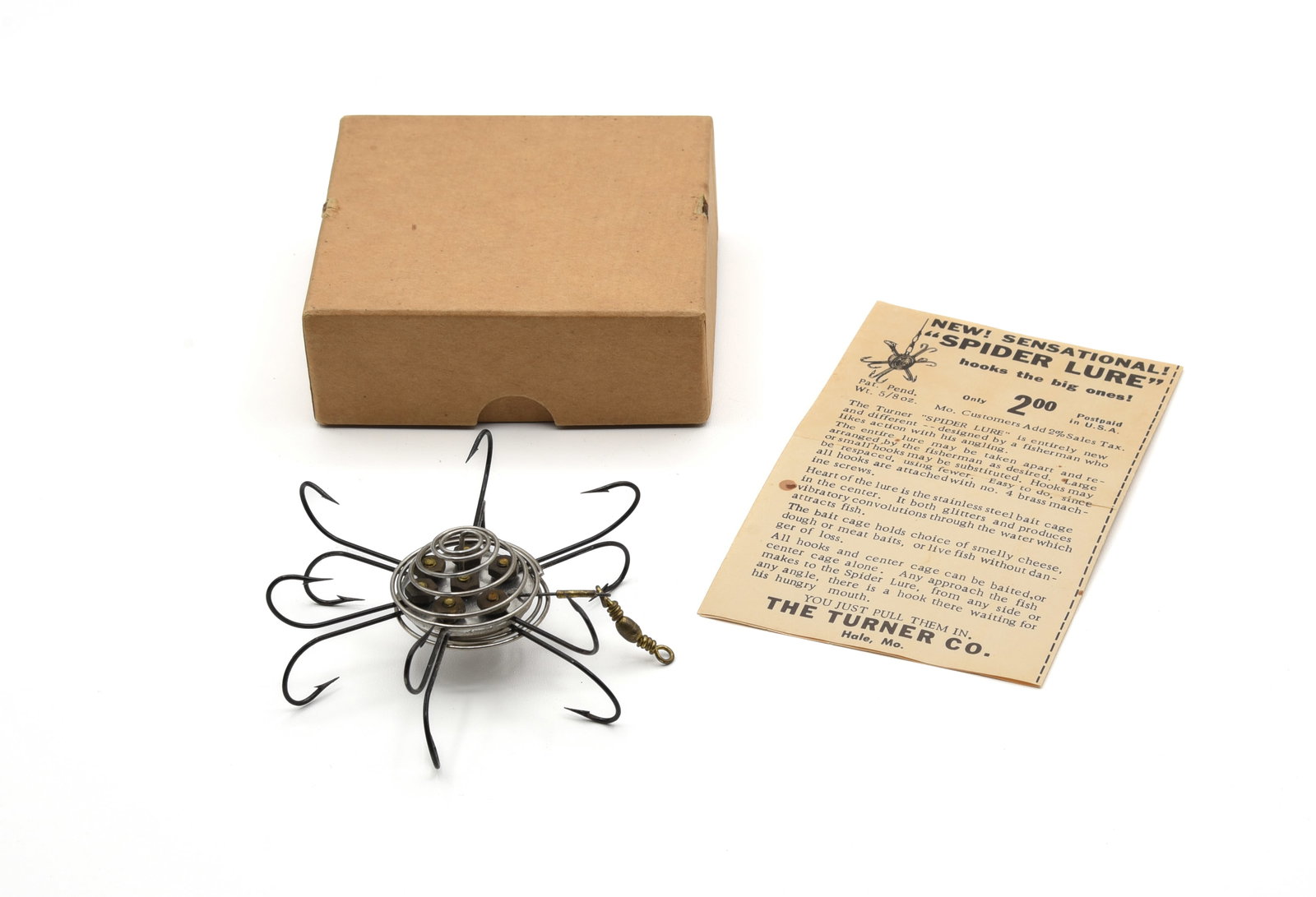 Turner Spider Lure: Late 1940s "as new" snag hook with center dead bait cage, made by the Turner Co. of Hale, Missouri. Coming in its 2 piece unmarked box (missing top of metal tabs), with crisp picture paperwork. Not