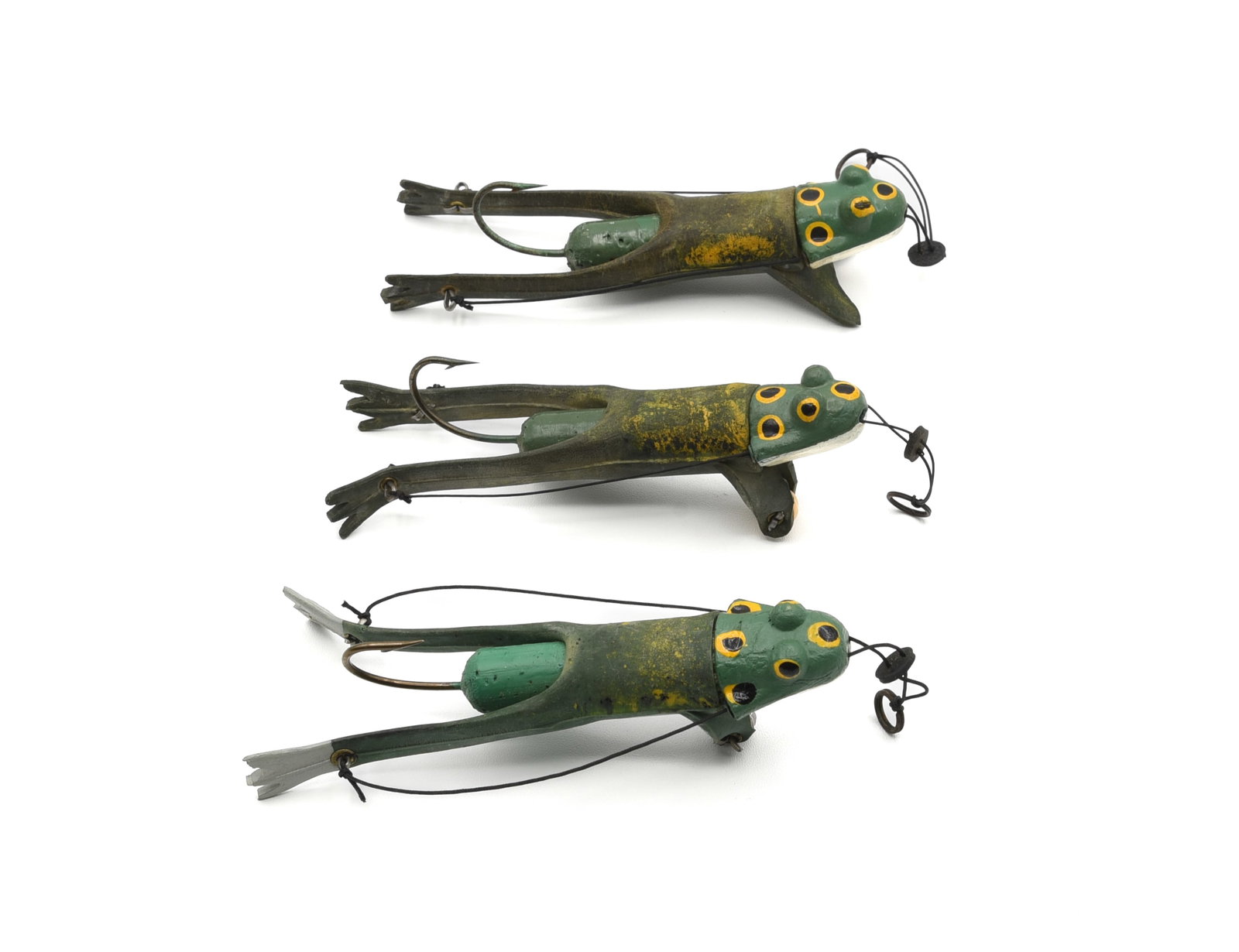 3 Gee Wiz Frogs: Different ages including a No. 6 with flat front feet, No. 3 with metal wheel, and a No. 6 with double plastic wheels. Each measures 4 1/4" in length including the rubber feet, condition is Ex- to