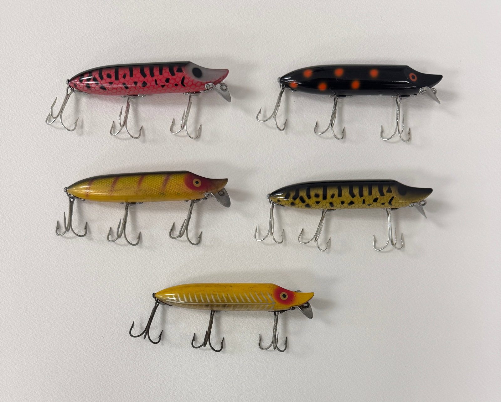 5 Heddon Vamp Spooks: Most are later models, all rigged with surface hardware and belly stenciled. Condition is Ex- to unfished Ex, bright and shiny.