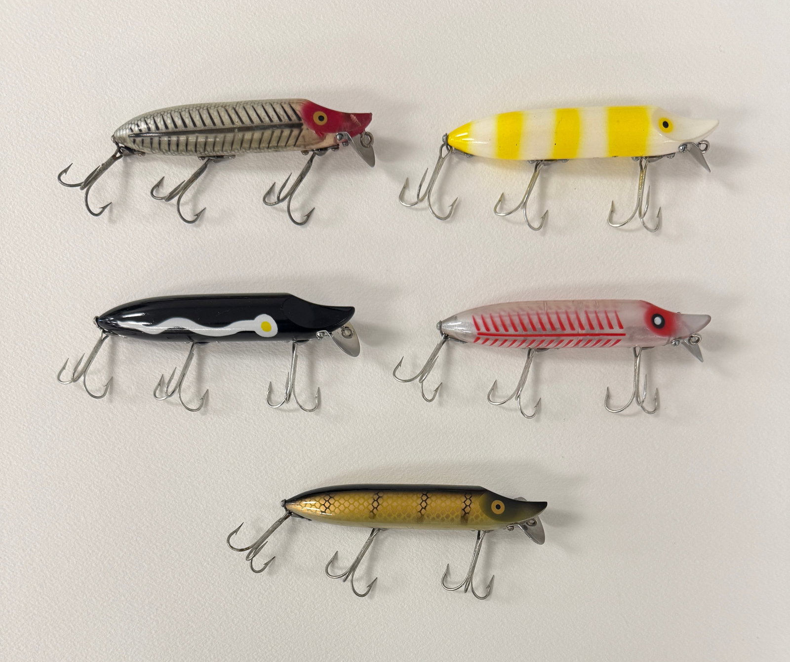 5 Heddon Vamp Spooks: Most are later models, all rigged with surface hardware and belly stenciled. Condition is Ex-/Ex to unfished Ex, bright and shiny.