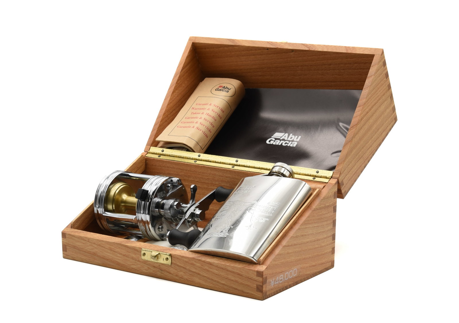 Limited Edition Ambassadeur Casting Reel: Numbered 452, this as new condition reel with bright chrome finish features a fishing scene on the tail plate and has a foot number of 070007. The wooden presentation box also holds a 3 1/2 ounce stai