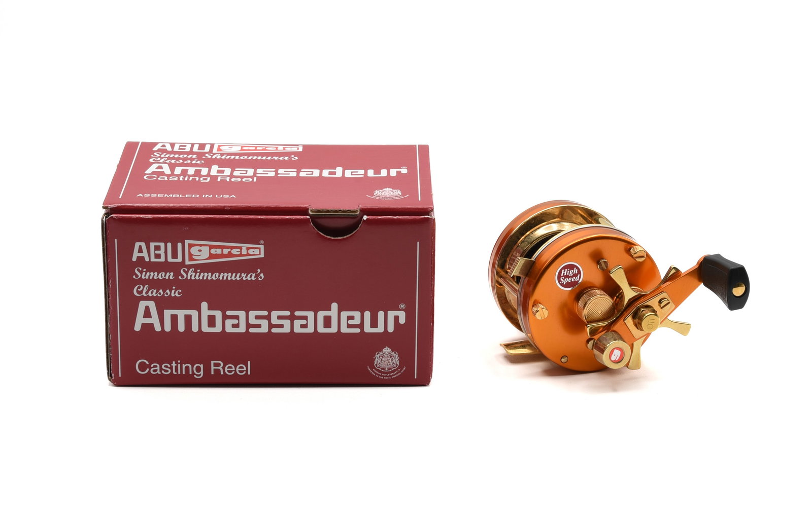 Ambassadeur "Shimomura" Casting Reel: Rare orange model with gold accents, right hand wind, single grasp counter-weight handle and 5-point star drag, this reel is not marked with the model number or serial number. New in the Simon Shimomu