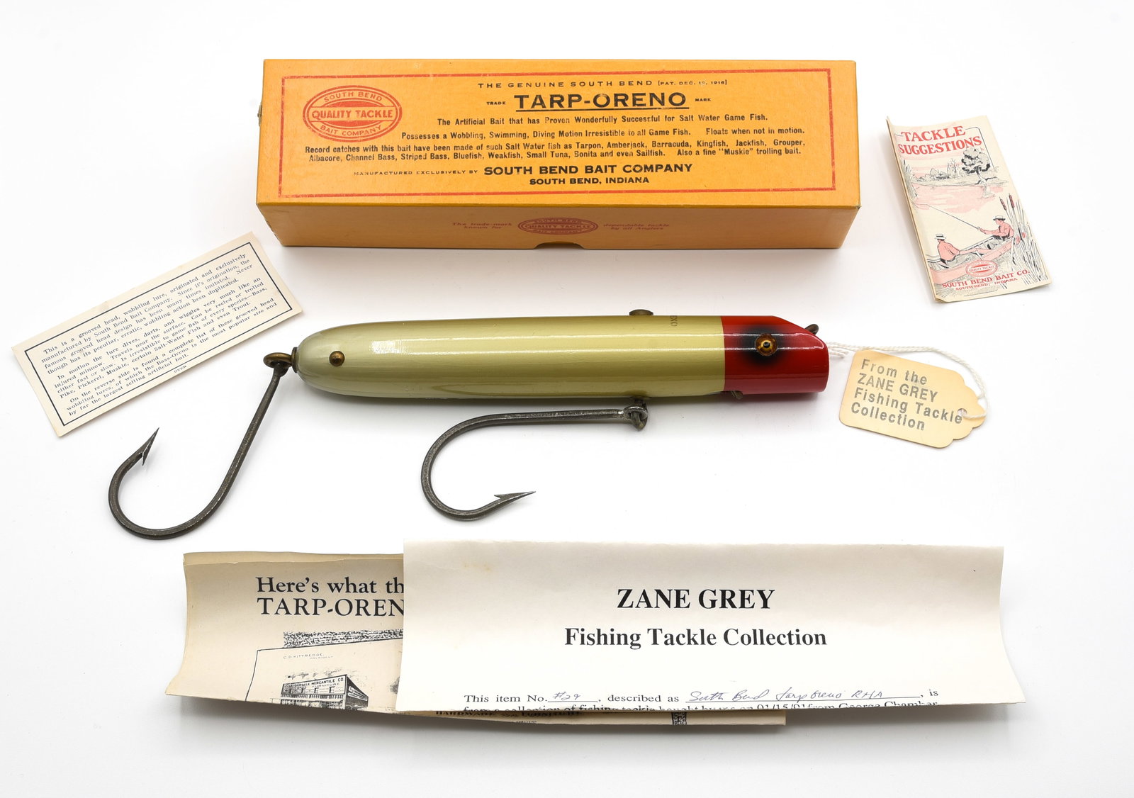 South Bend Tarp-Oreno - Zane Grey Owned: Beautiful bright red head aluminum finish, with crisp back stencil, swivel line tie and hook hangers, and rigged with two massive Mustad single hooks. Appearing unfished, about VG+ due to touchups to