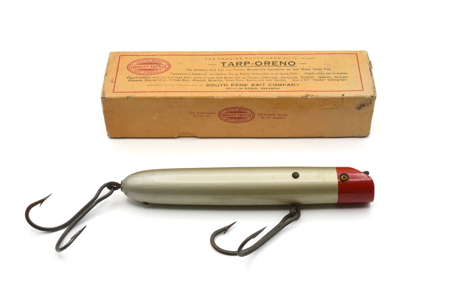 Early South Bend Tarp-Oreno: Rigged with swivel line tie and hook hangers, good glass eyes, side pin construction and finished in bright red head aluminum, grading at least Ex-/Ex with only light wear and nice dark patina on the 