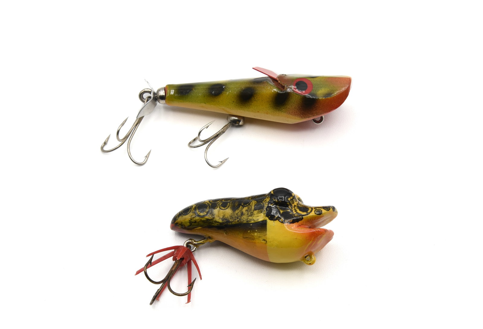 2 Bud Stewart Frogs: Rare open mouth Frog Hopper of painted cedar, 1960s, 2 5/8" and in shiny Ex condition. And a Thing-A-Ma-Jig, circa 1950s, frog paint pattern with a movable celluloid flasher. Similar lures can be seen