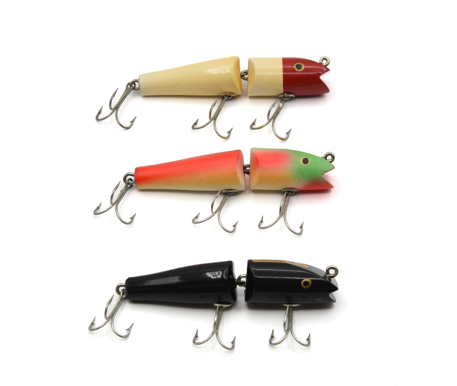 3 Creek Chub Jointed Darters: Includes a 4913 Special in solid black, an uncataloged color on the Jointed Darter, unfished, near Ex with a perfect gold foil back label. Also a 4902, red head white, Ex-/Ex, and a 4931, rainbow fire