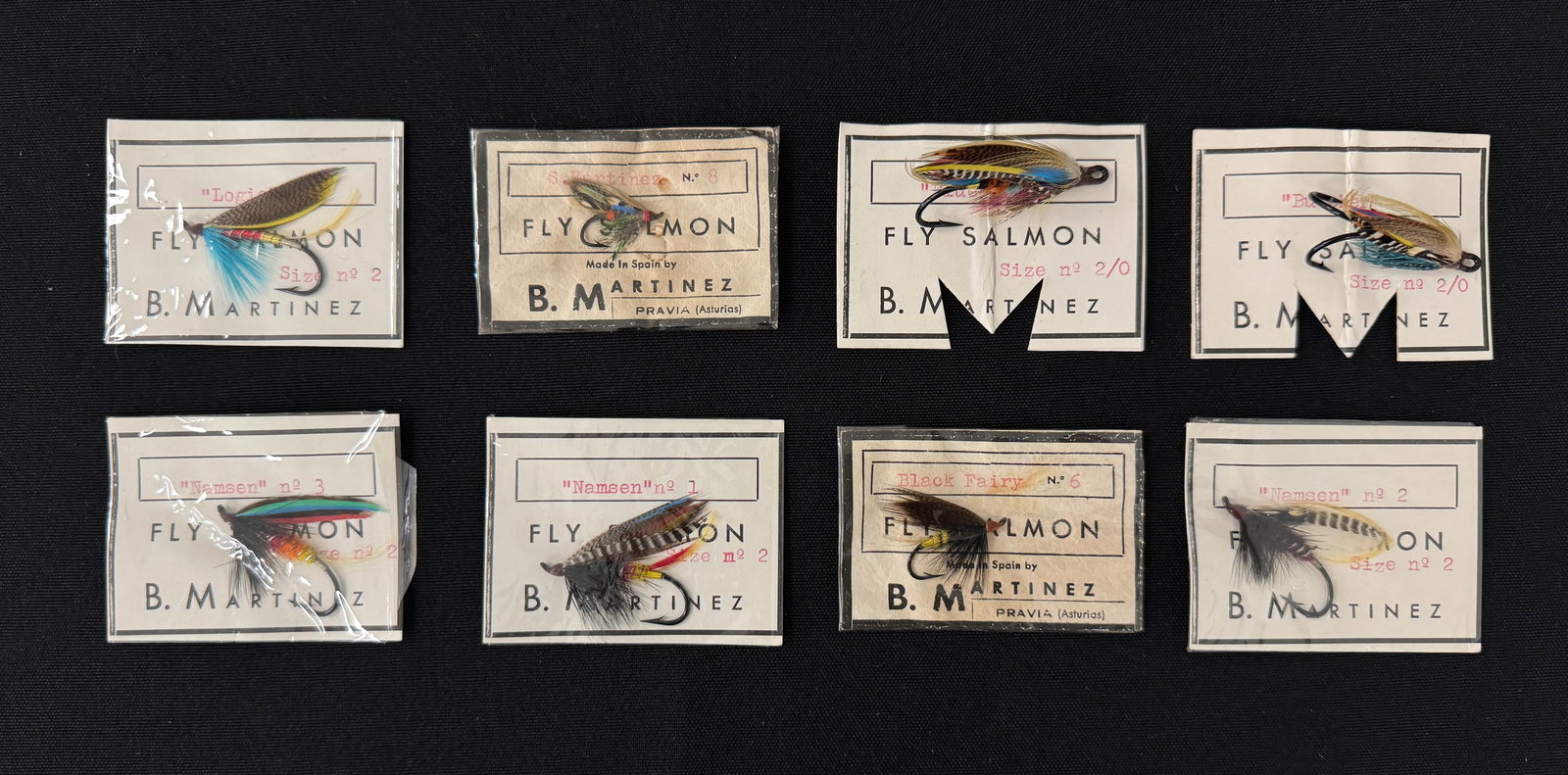 B. Martinez Salmon Flies: 8 unfished flies professionally tied by Spain's most respected fly dresser, Belarmino Martinez (1919-2000). A range of ages, each coming with its original card, the pattern and size stamped (6 still s