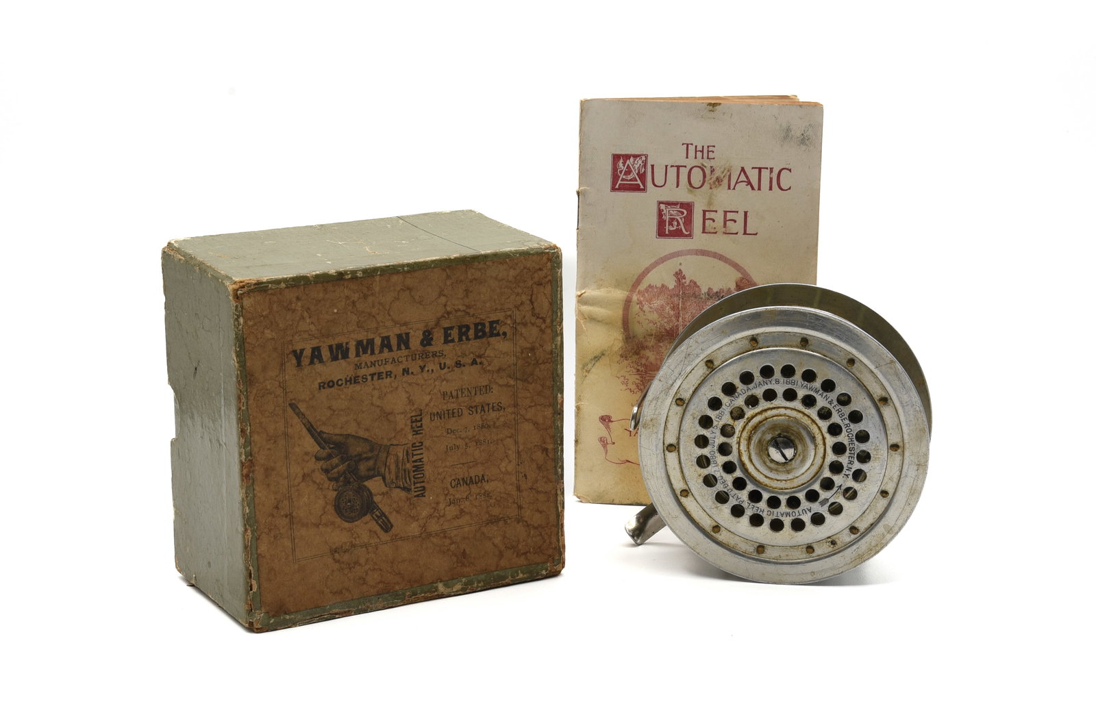 Yawman & Erbe No. 2 Automatic Reel: Aluminum "keyless" reel, 3 3/4" diameter with full length foot, about VG+ condition due to wear, surface scratches and needing a thorough cleaning. The rarely seen 2pc light green box retains its top