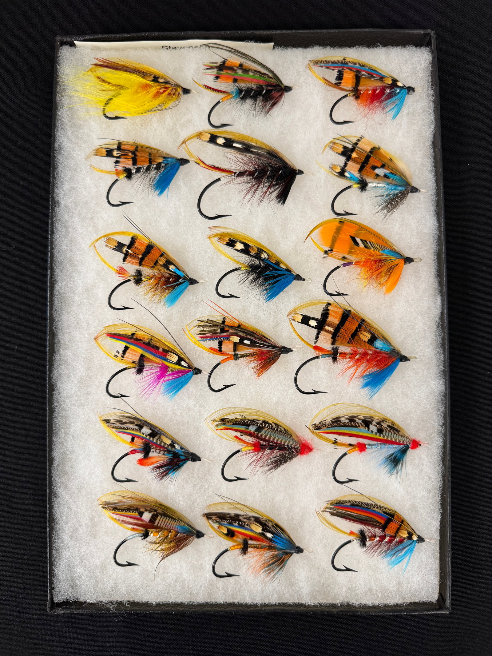 Bill Hrinko Salmon Flies: An extraordinary group of unused full dressed gut-eye flies by the late Atlantic salmon fly artist William "Bill" Hrinko. 18 flies in brilliant color and in excellent condition, measuring from 2 1/4"