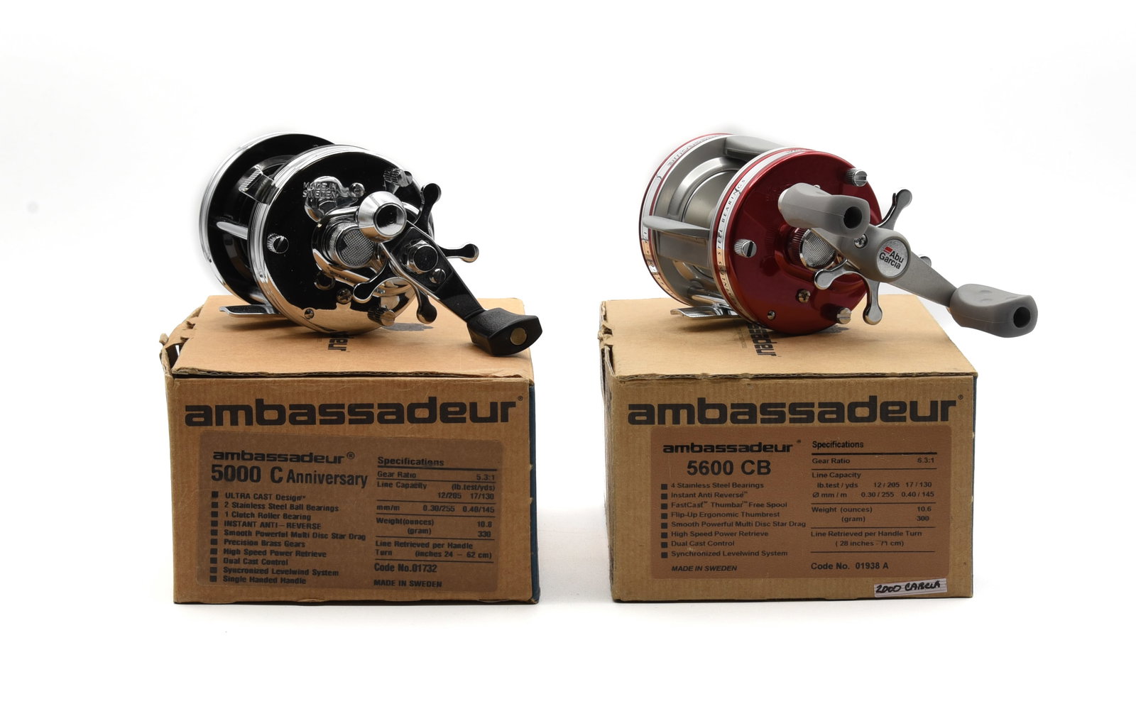 2 Boxed Ambassadeur Casting Reels: 5000 C Anniversary, silver, unfished Ex in the correct marked box with paperwork, oil, wrench and bag, and a 5600 CB, red, unfished Ex in the correct marked box with paperwork. The boxes grade Ex-/Ex.