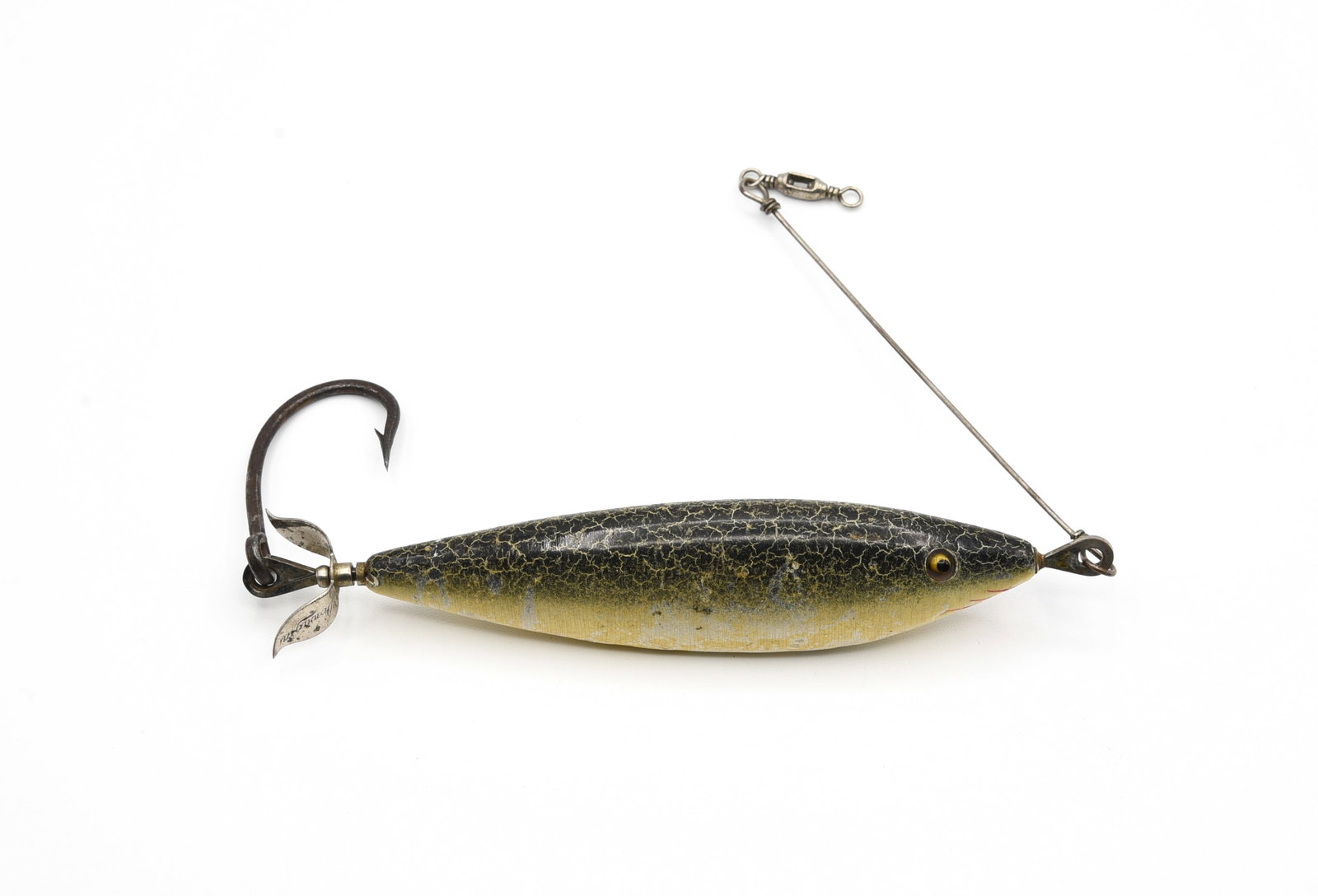 Heddon Coast Minnow: Measuring just over 5 1/4" in length, rigged with heavy duty flat hardware, original wire leader, rear prop, and finished in green crackleback with red hand painted gill marks. Condition is about good