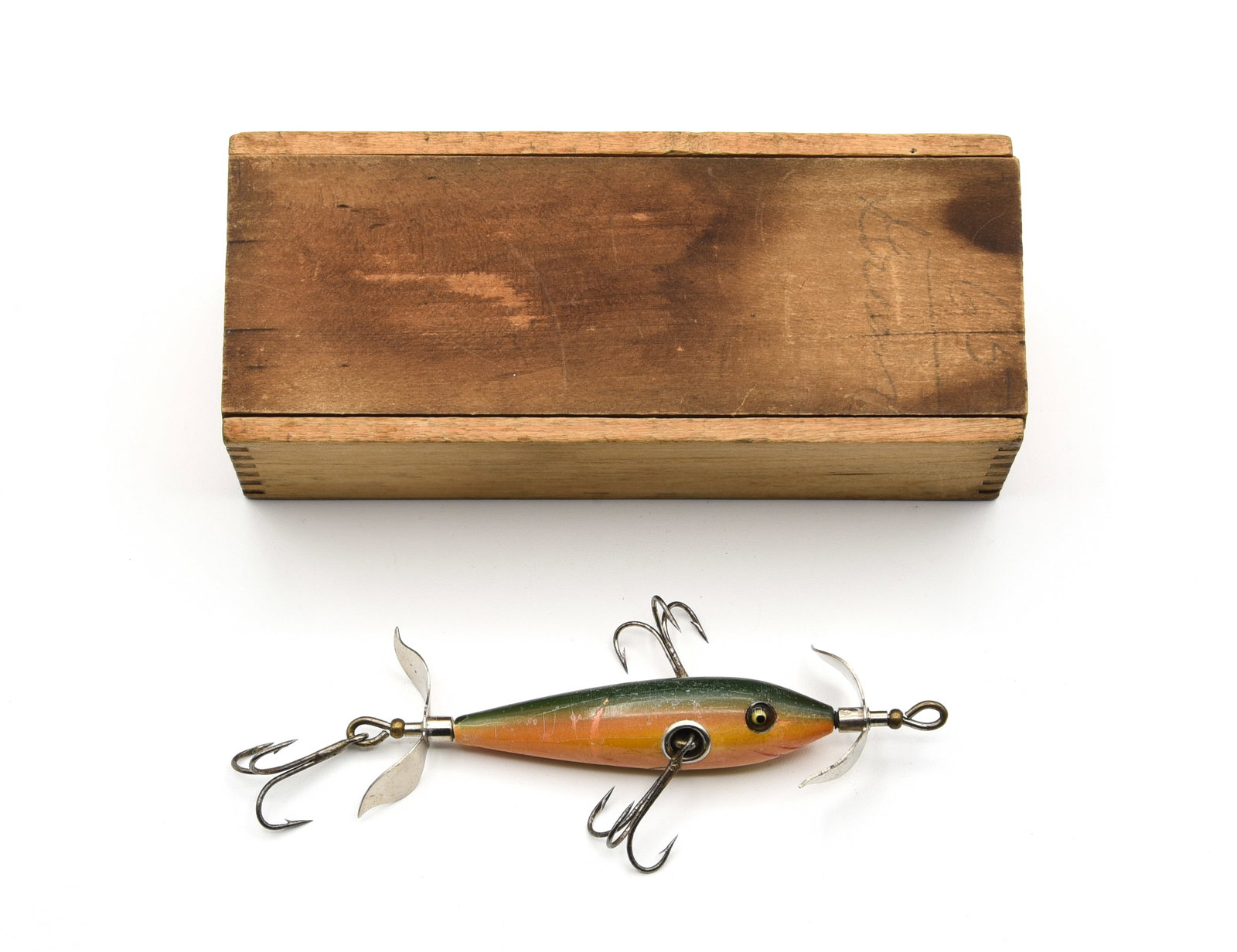 Heddon 101 Underwater Minnow: Early wood box model finished in rainbow with hand painted gill marks, unmarked props, cup hardware and good glass eyes, VG/VG+ with wear, scattered small flakes, hook marks, ring around the belly
