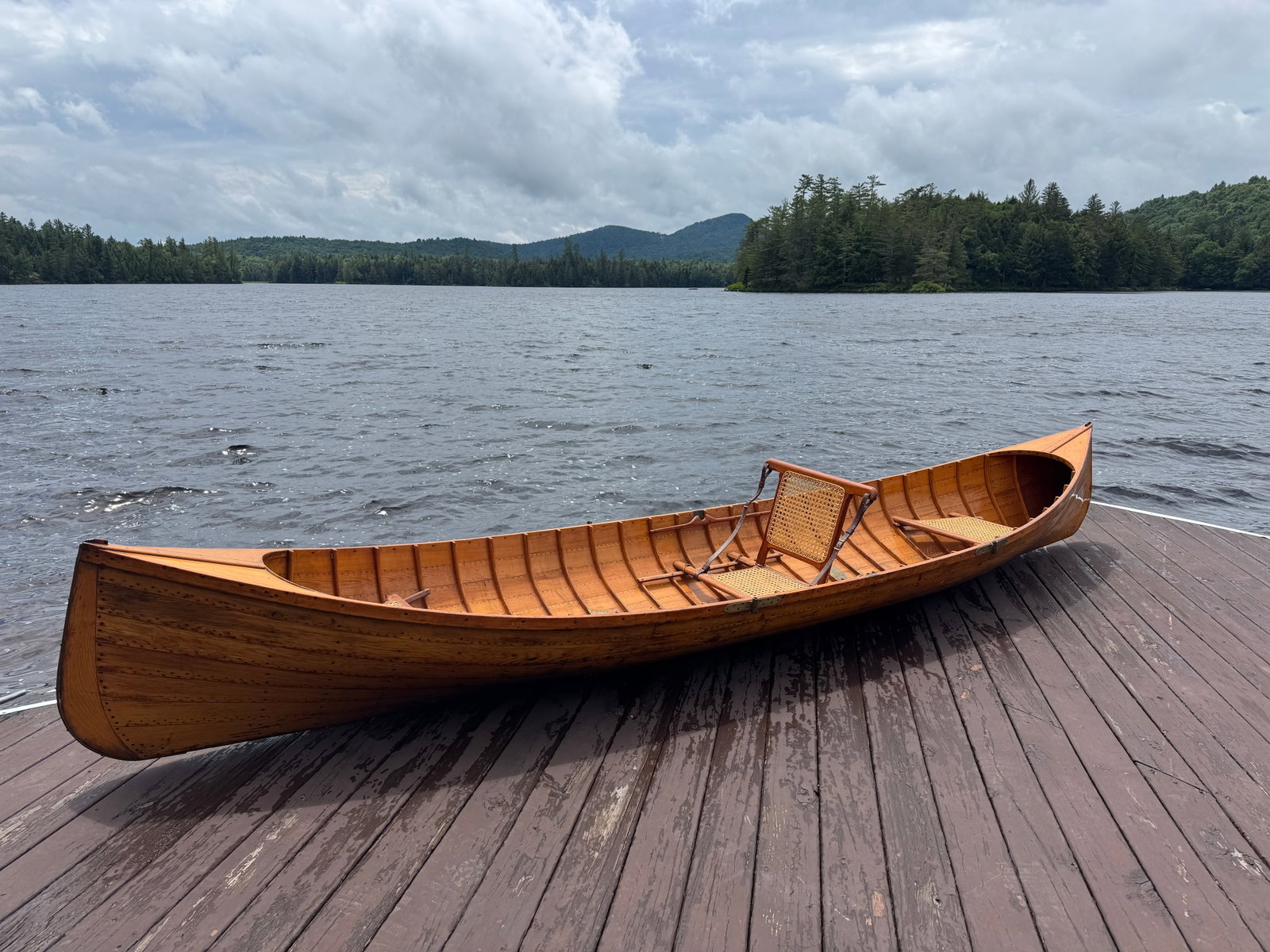 Martin 15 1/2' Adirondack Guideboat: Natural finish, inside and out, attractive boat in good usable condition, 39.5" wide, brass oar lock, 94" guideboat oars. Stenciled G8 from Whitney Park, Adirondacks.