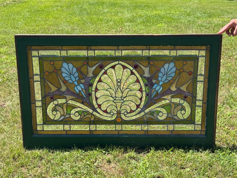 Stained Glass Window From the Late 1800s: originally out of a home in Watertown, NY. 27.5" x 46.5". Glass is all present and in good condition.