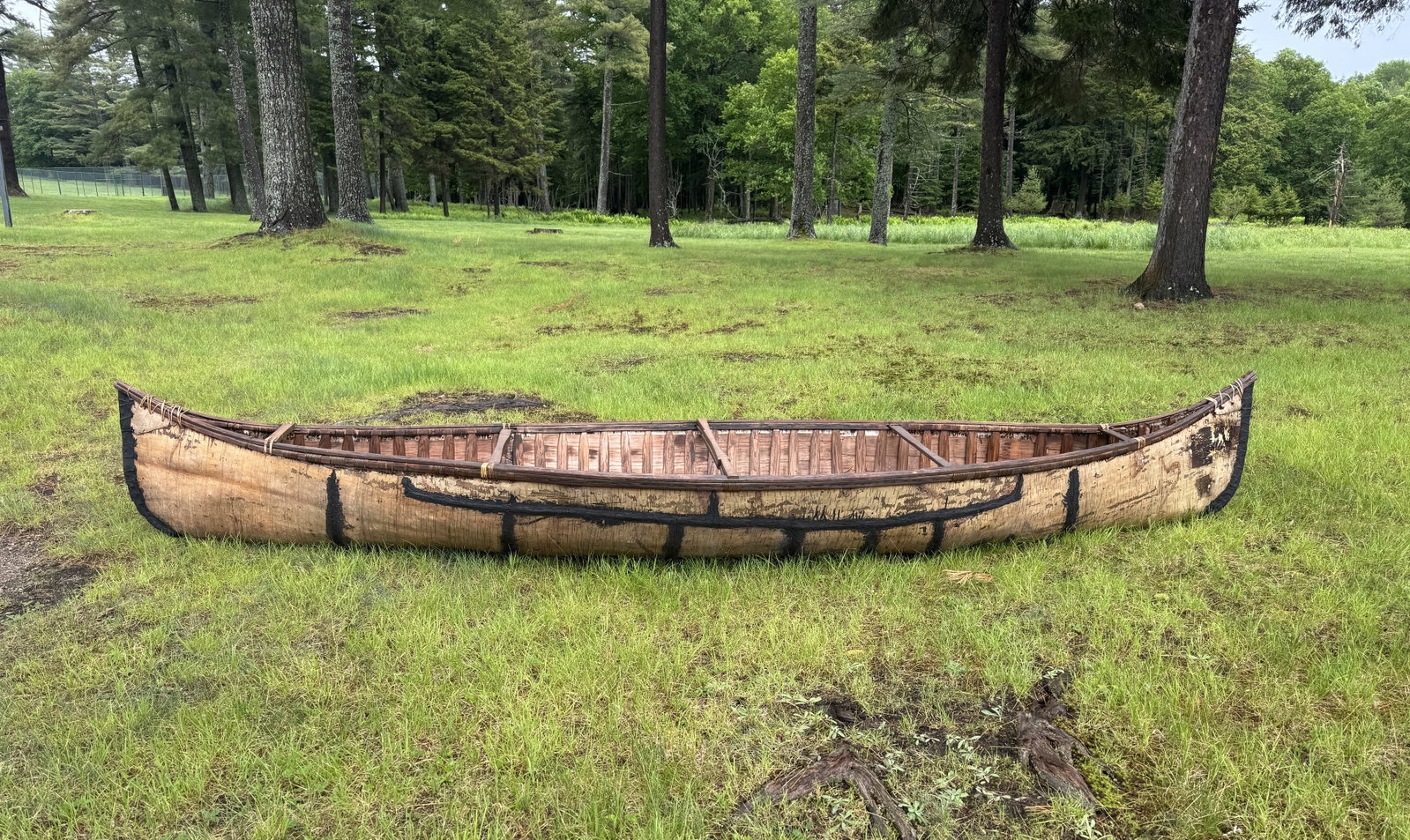 13' Birch Bark Canoe - Late 1800s: Attractive boat, good overall condition. Hung in the A-Frame on Forked Lake in Whitney Park. Boat has some restoration and repairs.