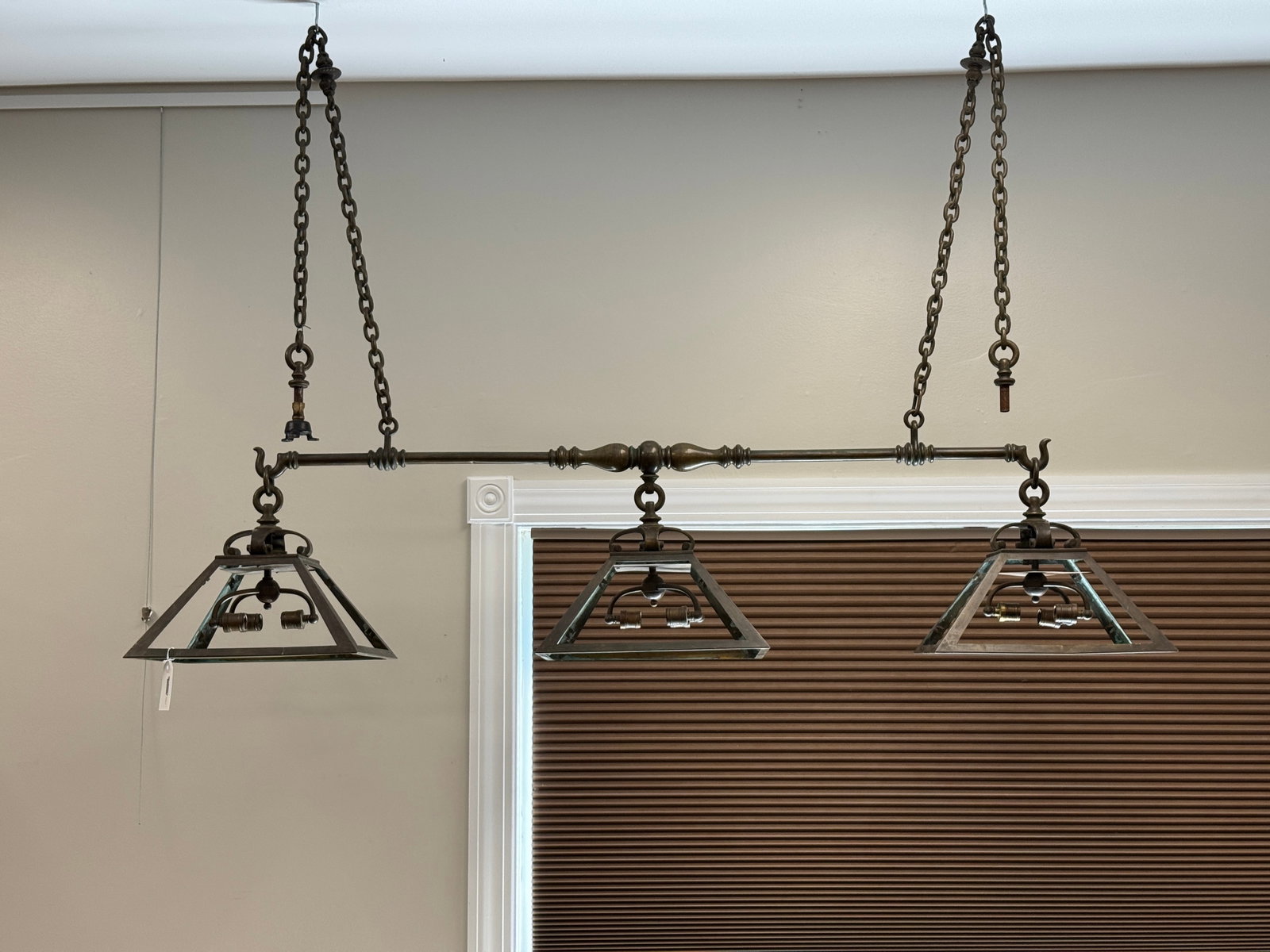 E.F. Caldwell Pool Table / Billiard Light: Bronze fixture 70" long, original patina, includes hardware and ceiling caps, signed with the Caldwell C. Includes only a few pieces of the green and white glass. Needs re-wiring. Originally taken out