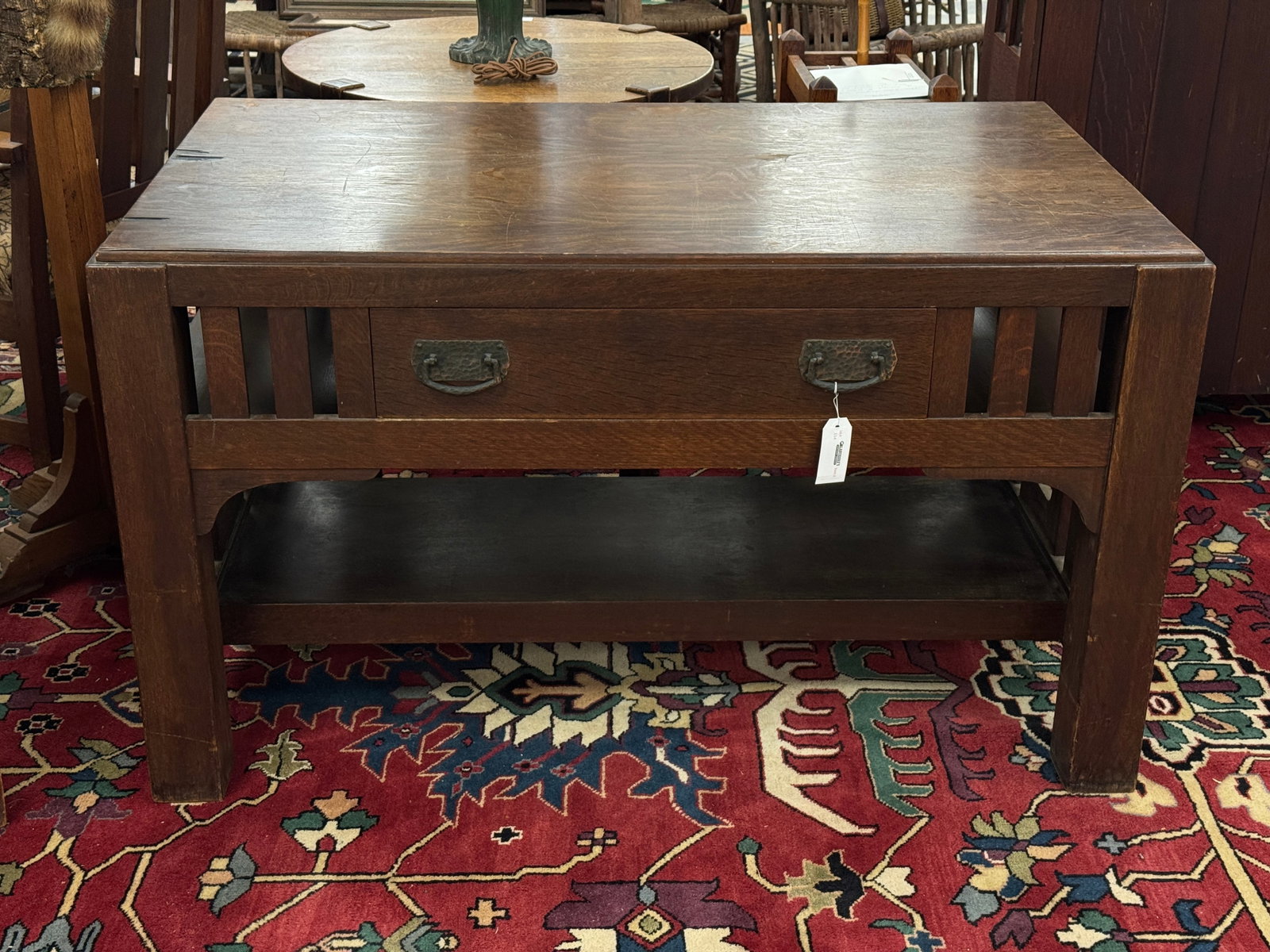 Quarter Sawn Oak Mission Library Table: Marked on bottom of drawer # 2928. Original varnish. Some veneer damage to top. 50.5" wide x 30.5" deep x 29.25" tall.