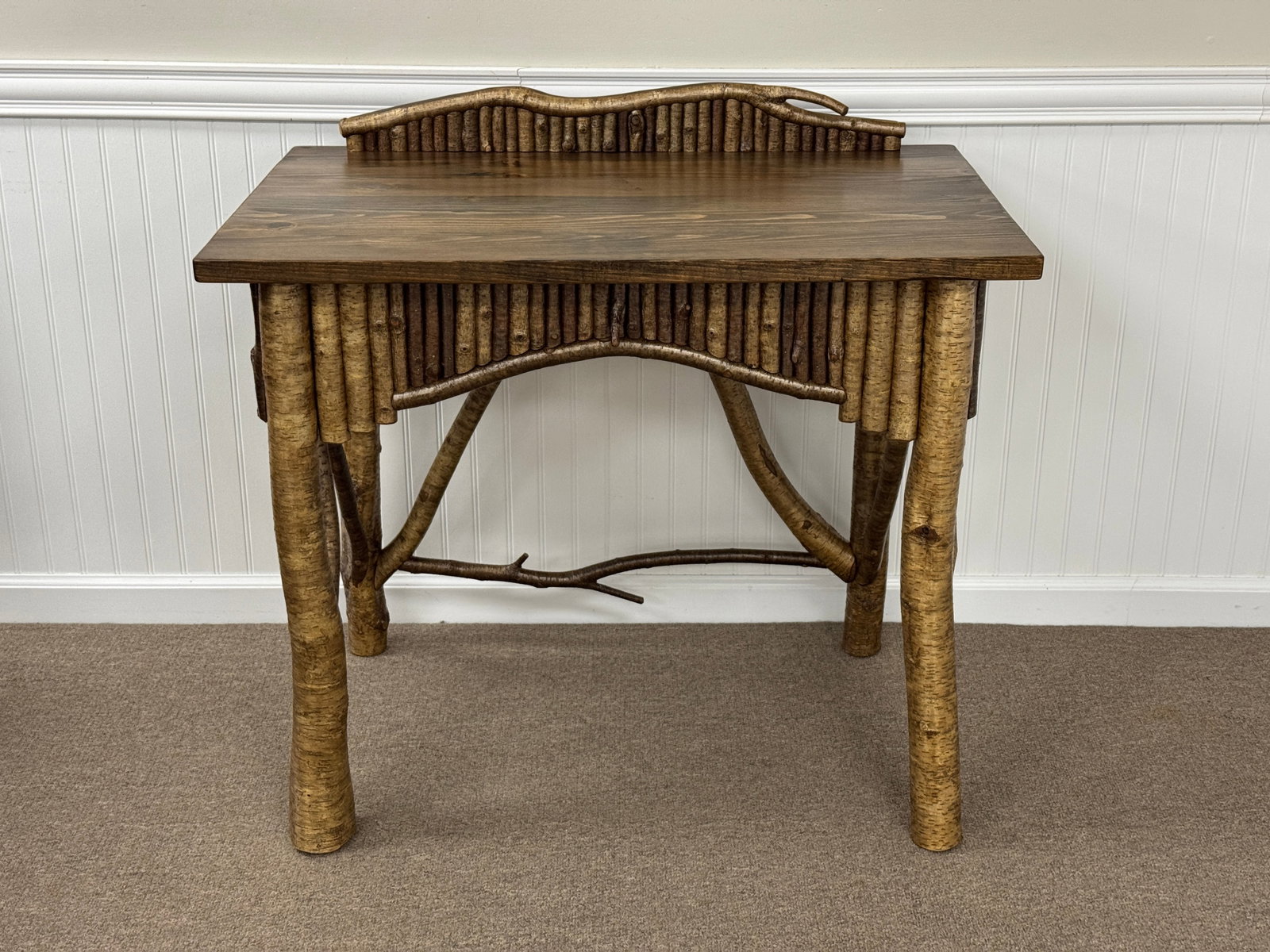 Adirondack Mosaic Writing Desk: Back Trail By Charlie Brown . Made of yellow birch with pine top. 36" x 24" x 33 1/2" to the top of the gallery. Well constructed, good form, finished on all 4 sides.