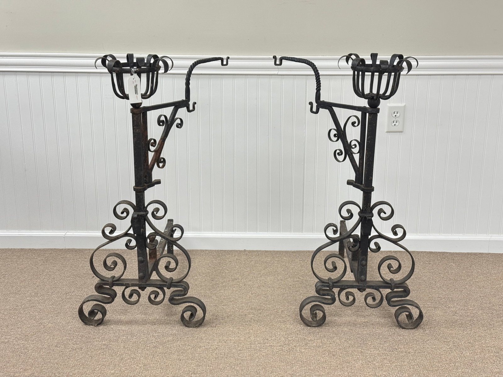 Impressive Wrought Iron Fireplace Andirons: with fancy scroll and basket tops. Both with swinging arms to hold cookware. 37" tall.
