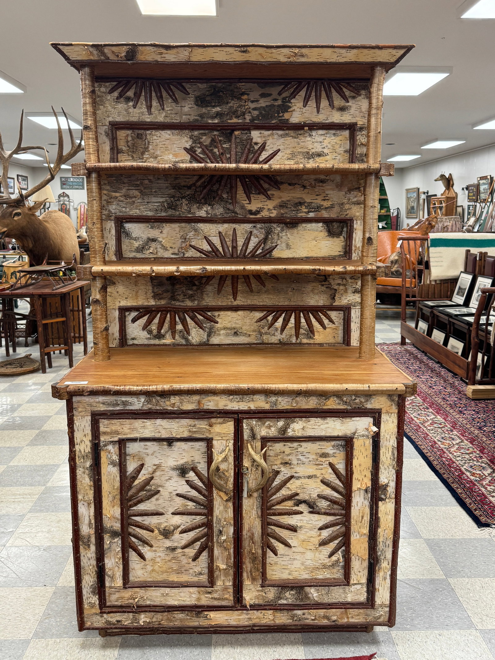 Adirondack Step Back Hutch by Jim Howard: In the style of Adirondack builder Ernest Stowe. decorated with birch bark, twigs, antler pulls, pine shelves and top. From Camp Deerlands, Whitney Park. 44" wide x 76" tall. 23" deep. Circa 1993.