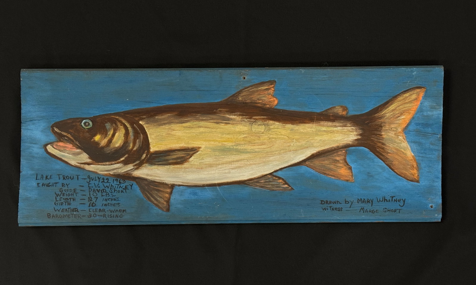 Marylou Whitney Lake Trout Painting: Caught by C.V. Whitney 1963, 27" lake trout with Guide David Short. Painted by Marylou Whitney. Folk art painting on wooden board from Trappers Cabin at Salmon Lake in Whitney Park. Board measures