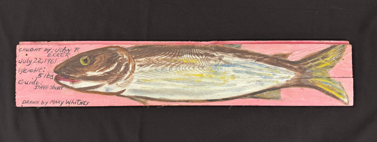 Marylou Whitney Fish Painting: Caught by John. F. Ecker, 1961 with guide Dave Short. Board is 28.5" x 5.75". Painted by Marylou Whitney. Folk art painting on wooden board from Trappers Cabin at Salmon Lake in Whitney Park.