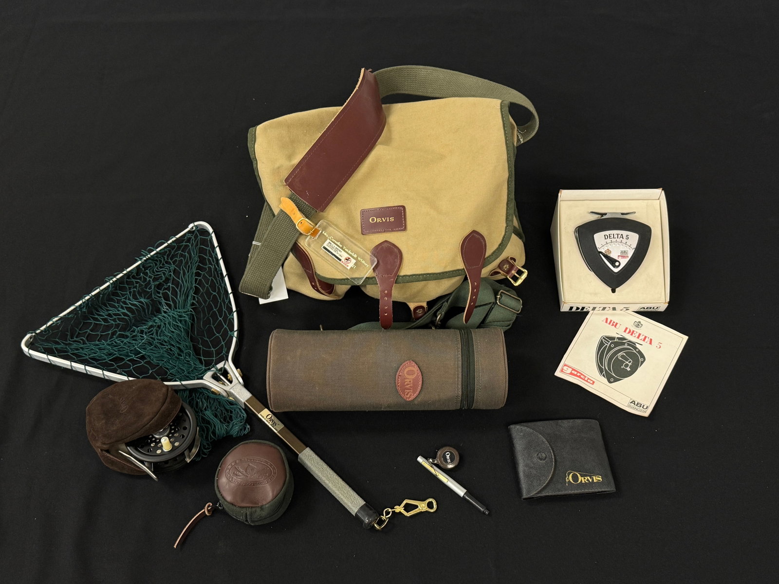 Mrs. C.V. Whitney's Orvis Fishing Gear: Includes: Canvas creel, folding net, thermos and miscellaneous reels and gear.