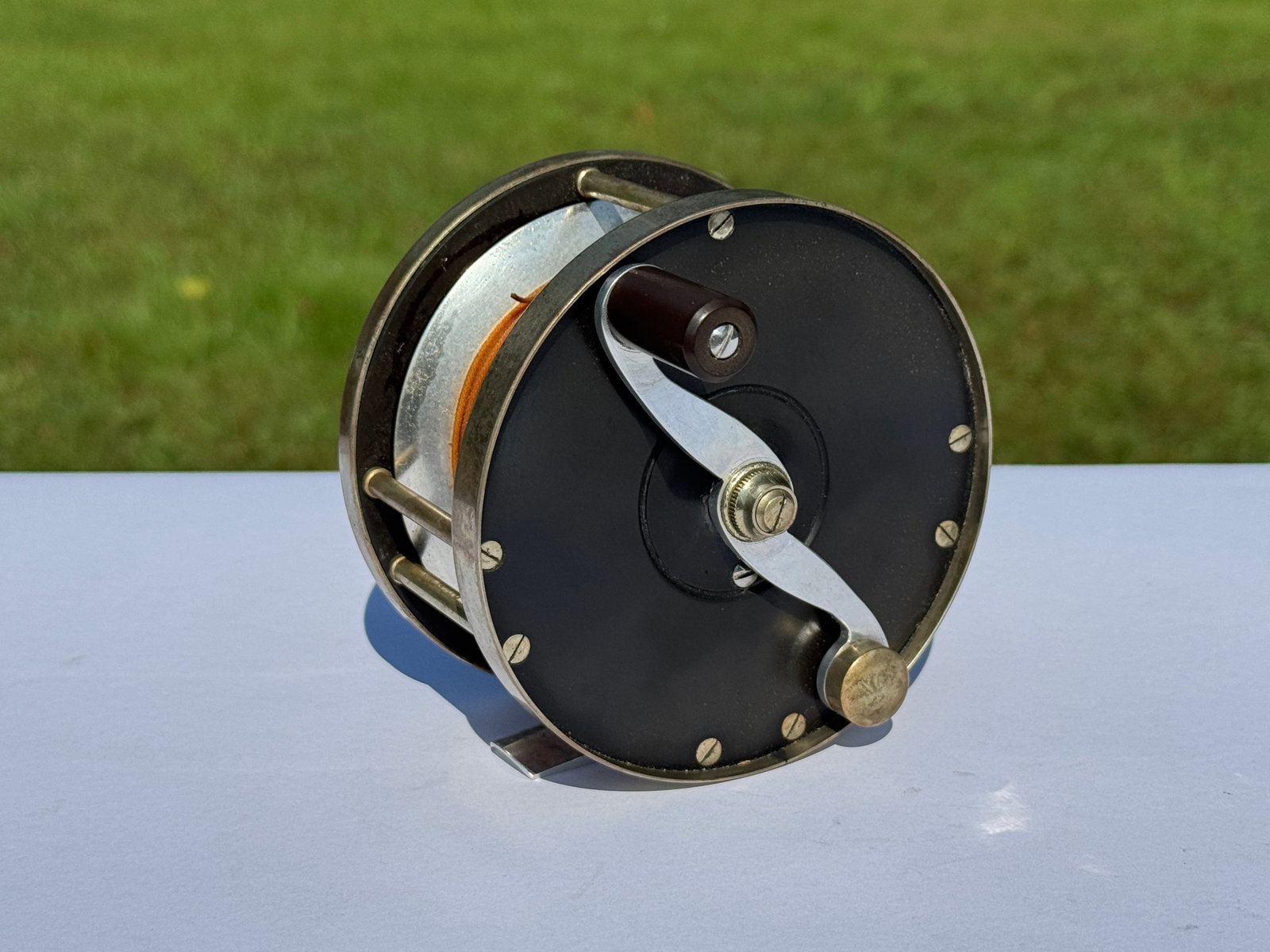 Arthur Walker Salmon Reel: made in West Hempstead, NY. Base is marked 200 6/0. Right handed. Model A40. 3.25" diameter. Owned and used by C.V. Whitney for Salmon Fishing. From Whitney Park.
