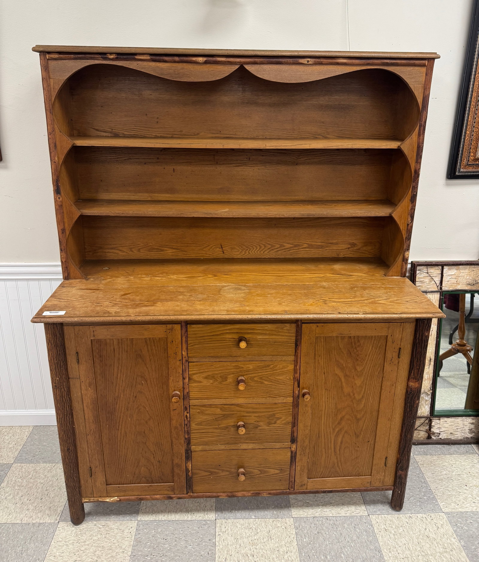 Old Hickory Branded Step Back Cupboard: circa 1930. Referred to in the Old Hickory 1931 catalog as No. 5080 a welsh dresser. Measures 53" wide x 69" tall x 22" deep. Original finish and condition. Damage to a piece of trim on the bottom lef