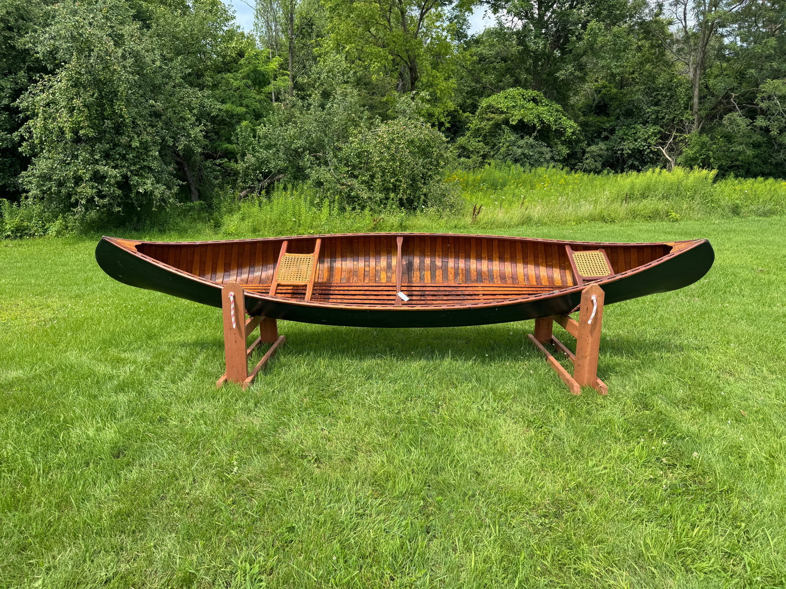 Old Town 15' Wood Canva Canoe: Serial number 111277. Painted green, canvas in good condition, seats are in good condition, can put in the water and use. From Whitney Park, Adirondacks.
