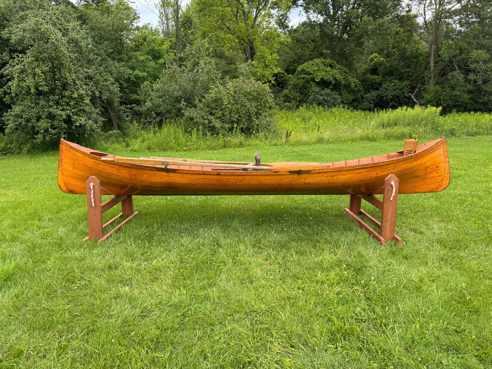 Adirondack Guideboat - 15' long: Natural finish inside and out., natural finish oars, center seat needs caning. This is a solid boat that need a good cleaning and light restoration. It could be restored to be used or would display we