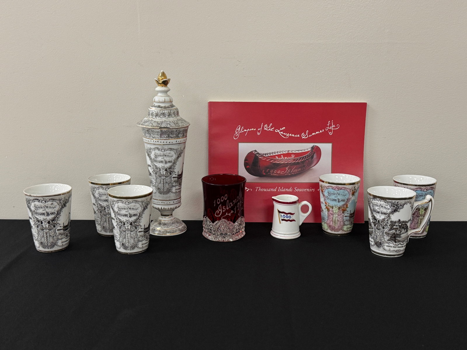 Thousand Islands Souvenir China & Glassware: includes: 9 pieces, largest covered jar has a chip in the underside of rim and measures 10.5" tall. Made in Austria for Nash Brothers Steamboat Agents, Clayton, NY. Also includes a Thousand Islands So